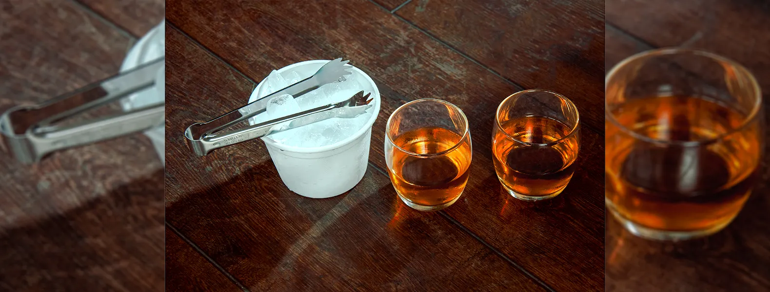 Kit para whisky. Conta com dois copos para whisky em vidro, pegador para gelo em aço inox e balde para gelo 750 ml em alumínio branco.